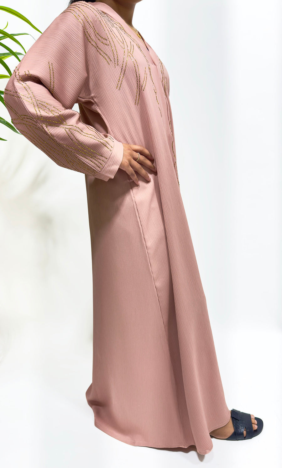 Blush open abaya layered over an inner dress