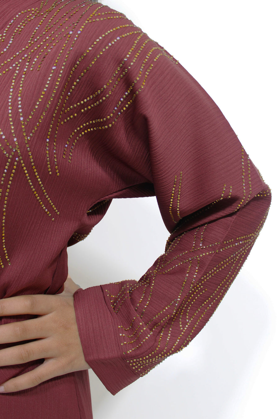 Full-length view of Amani's plum gold embellished open abaya
