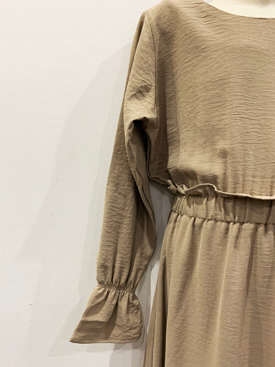 Full-length view of Amani's Haya sand maxi dress