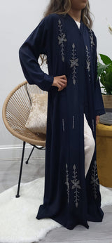 Girl wearing Amani's navy blue handmade beaded open abaya with belt and scarf