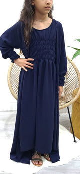 Girl wearing Amani's navy blue jacket-style abaya set with belt and scarf