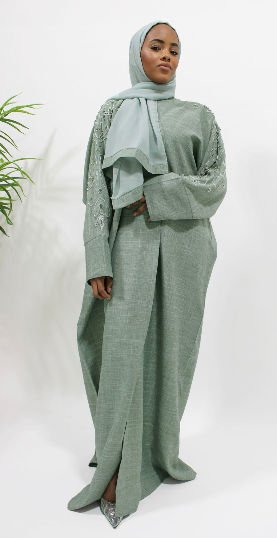 Full-length sage-toned greenish grey linen bisht abaya draping from the shoulders