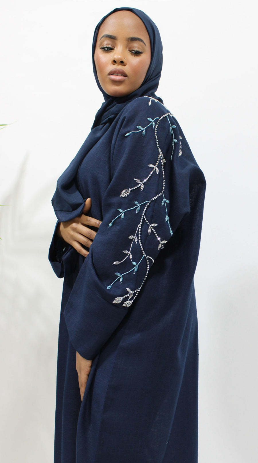 Full-length deep navy linen bisht abaya draping from the shoulders