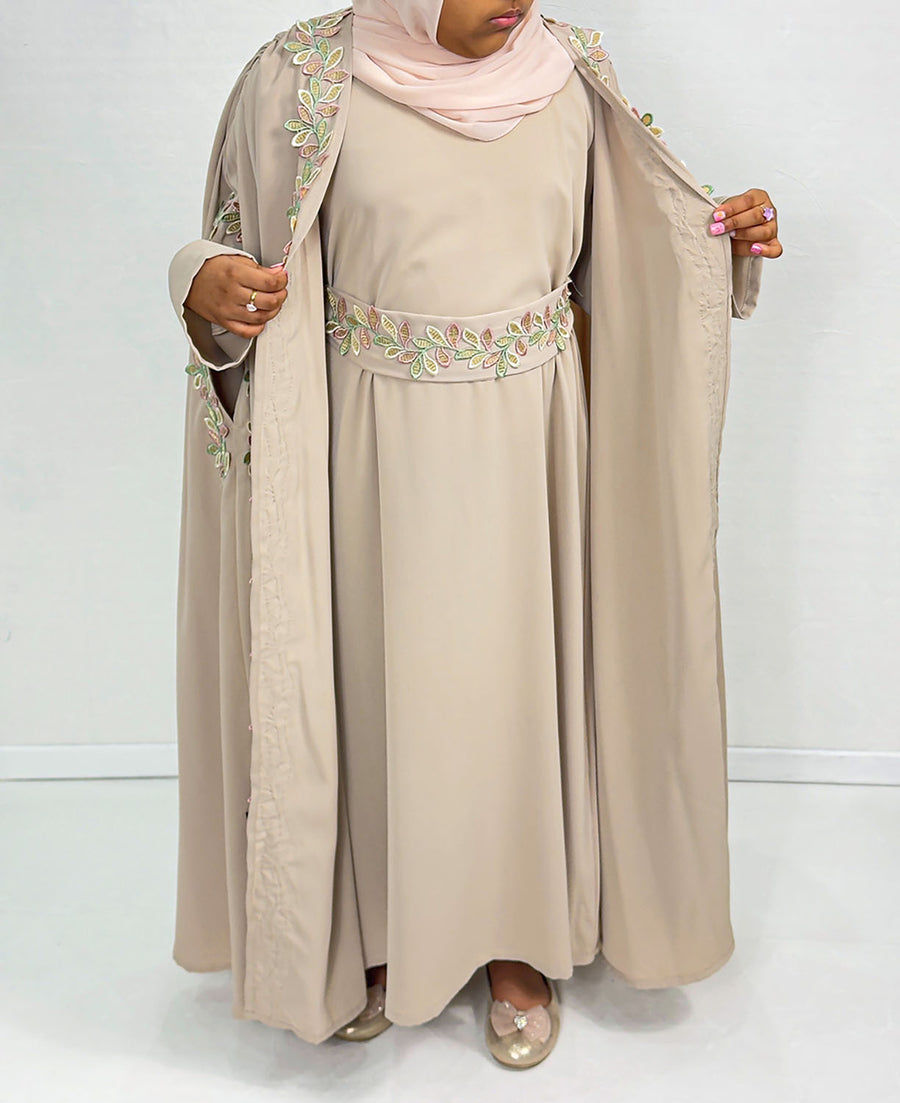 Girls' almond cape abaya set showing leaf embroidery applique