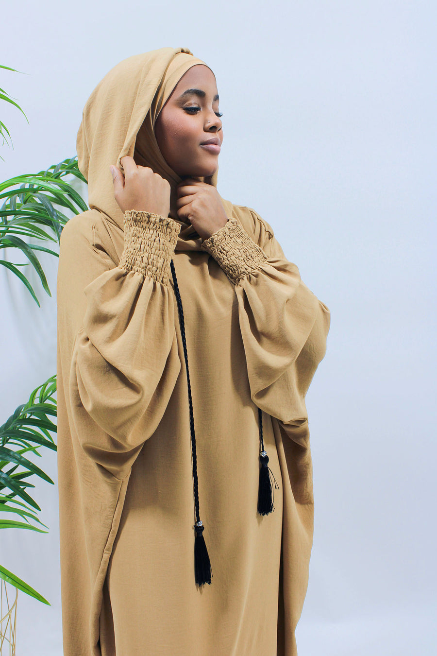 Mustard hooded prayer abaya showing its full-length relaxed cut