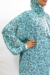 Bright turquoise lace trim floral prayer dress with attached hijab, front view