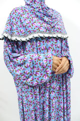 Light blue floral slip-on jersey prayer dress with attached hijab, front view