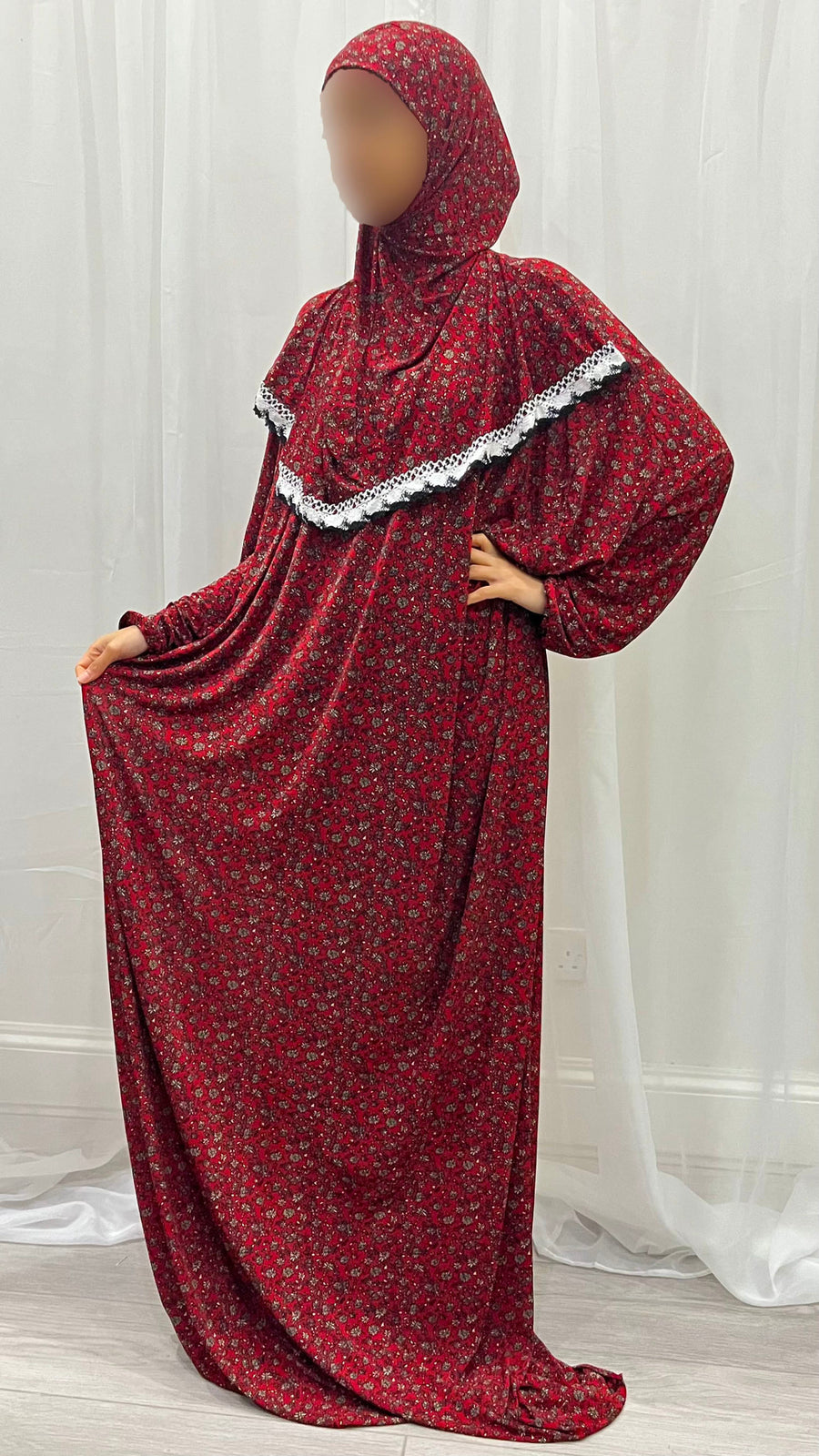 Red floral jersey prayer dress showing the attached hijab