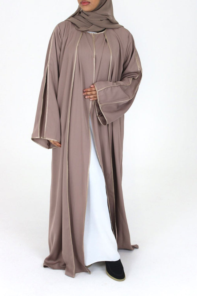 Woman wearing Amani's rose taupe open abaya with satin piping and scarf