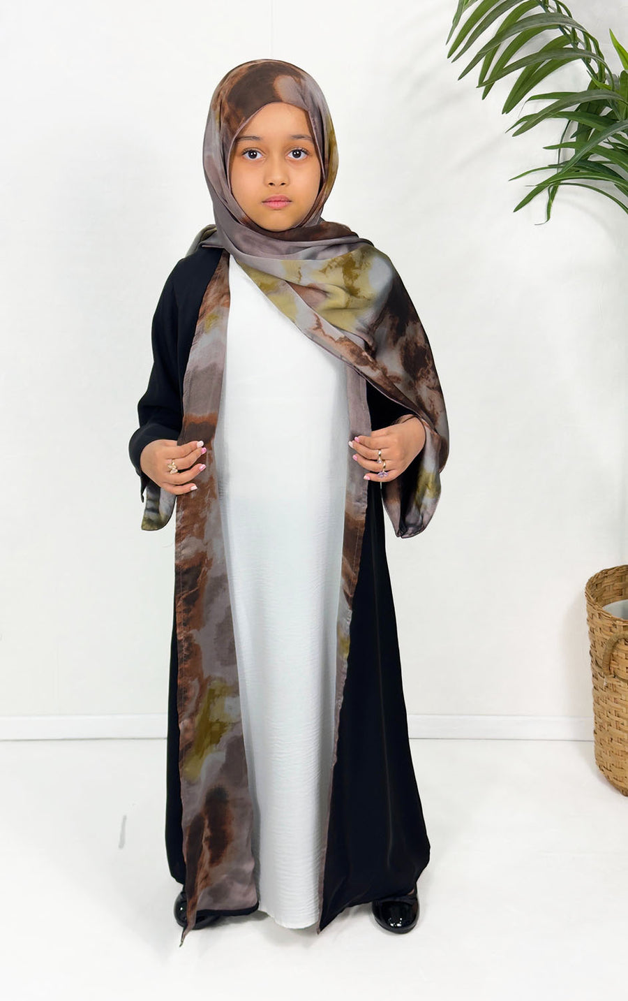 Girls' open abaya showing the brown watercolour lining
