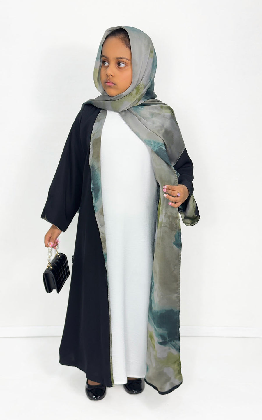 Girls' black open abaya with green satin chiffon lining, front view
