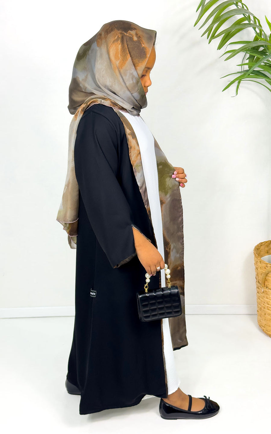 Girls' open abaya showing taupe watercolour satin chiffon lining