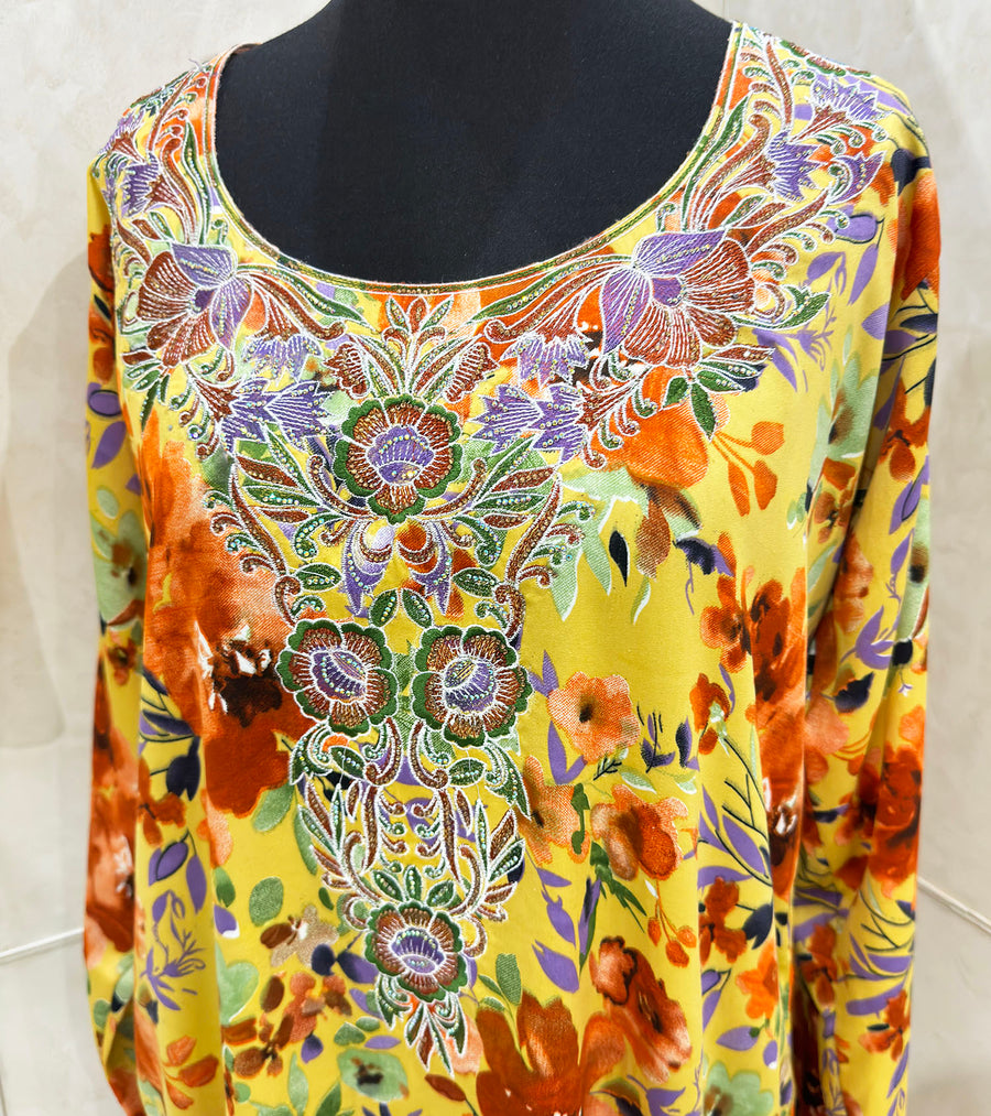 Embroidery and crystal cut-work neckline on the orange mukhawar dress