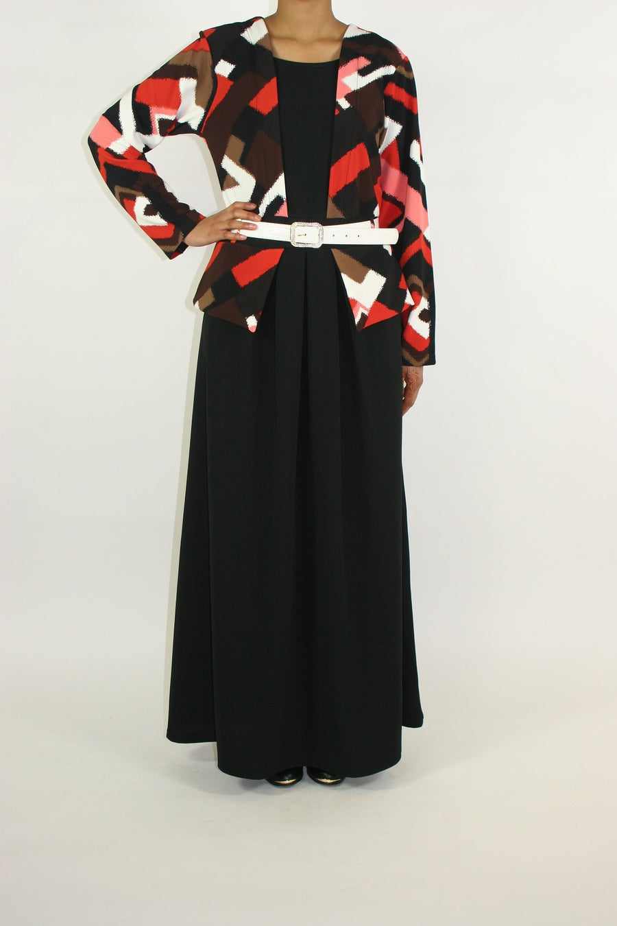Waistline pleat and jacket-effect detail on the orange jersey maxi dress