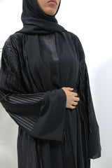 Black pleated satin open abaya shown front-on with matching belt and hijab
