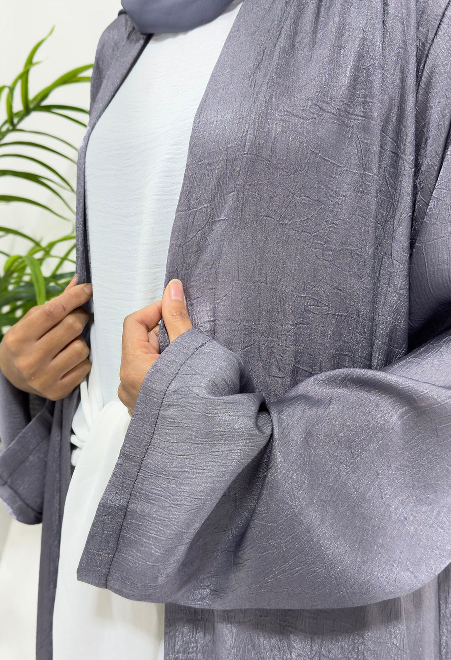 Side view of the violet shimmer open jacket over the white inner dress