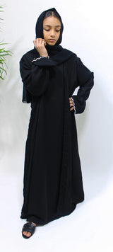 Girl wearing Amani's black two piece style open abaya with scarf