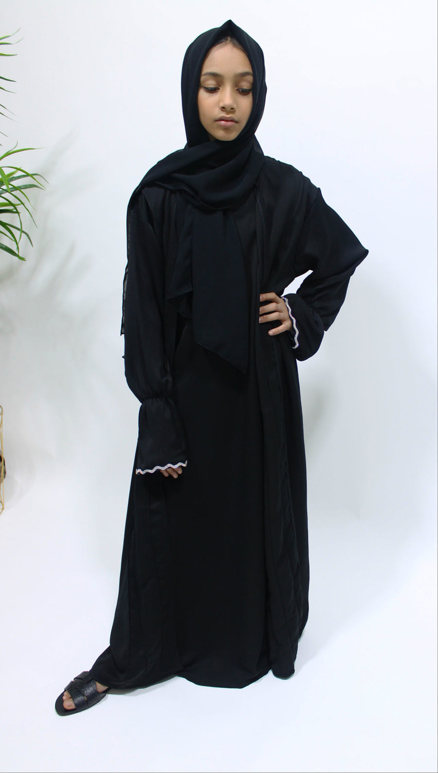 Full-length view of Amani's black two piece style open abaya