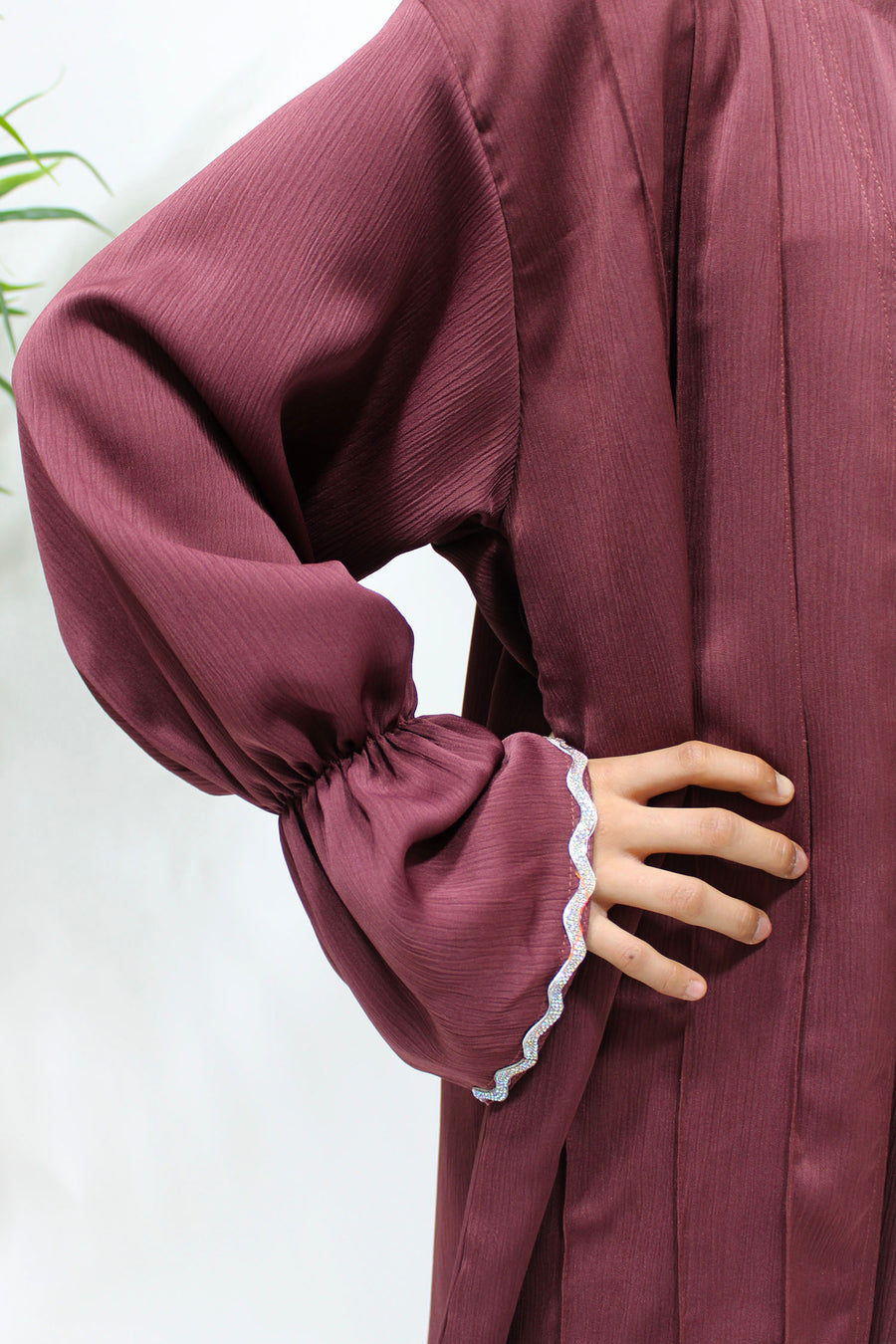 Full-length view of Amani's plum two piece style open abaya