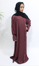 Girl wearing Amani's plum two piece style open abaya with matching scarf