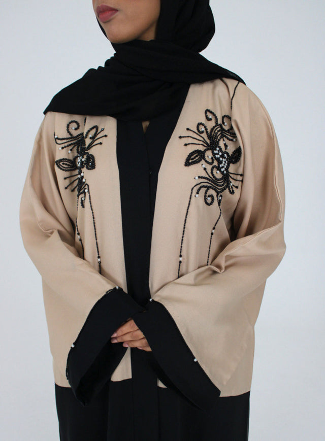 Cream and black open abaya jacket, front view