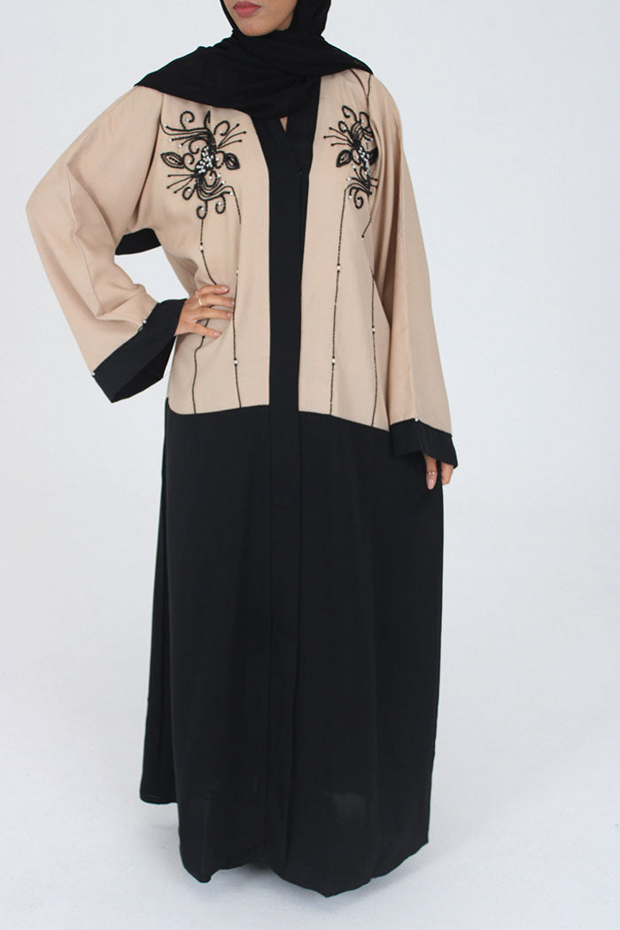 Cream and black open abaya jacket showing the drape