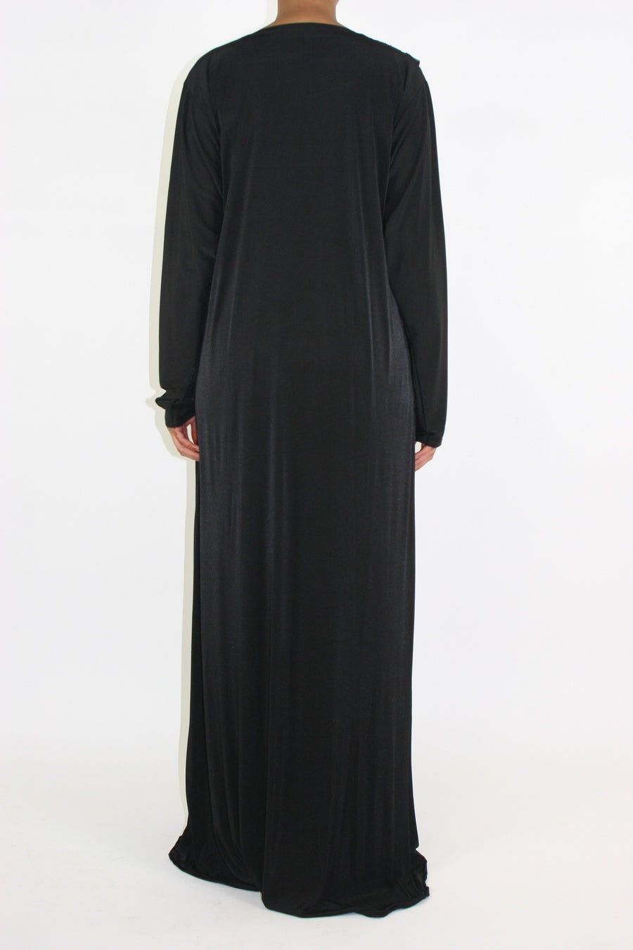 Close view of the button closure and satin flap on the black jersey abaya