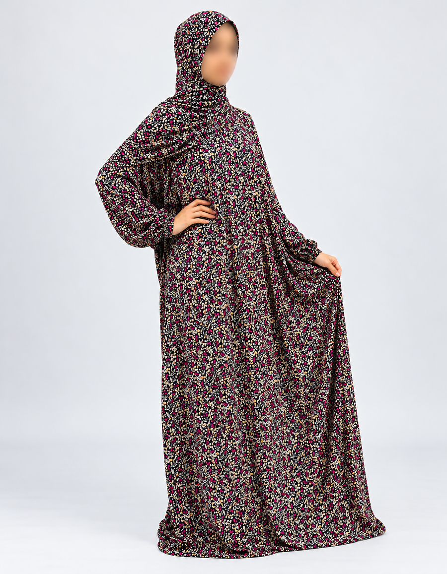 Black and fuchsia floral prayer dress without lace, three-quarter model pose with sleeves down and natural drape