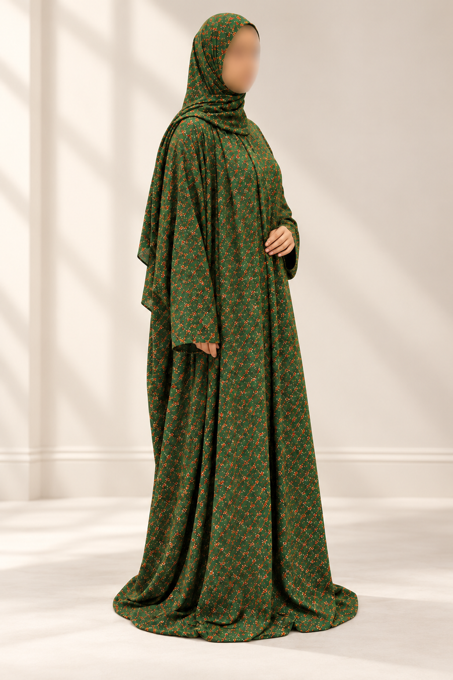 Moss green floral one piece prayer dress with attached hijab, three-quarter studio view