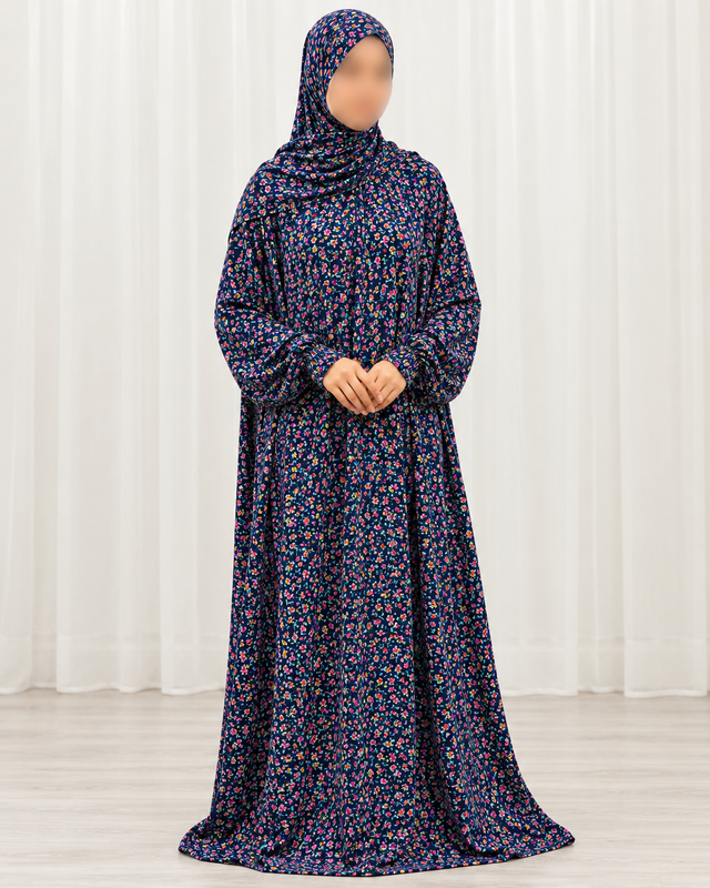 Amani's navy mini floral one piece prayer dress with attached hijab, front view showing sleeves down naturally, no lace