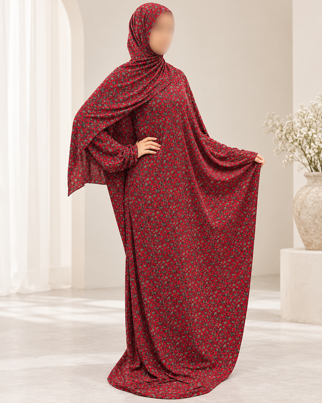 Amani's red micro floral one-piece prayer dress with attached hijab, lace-free front and flowing silhouette