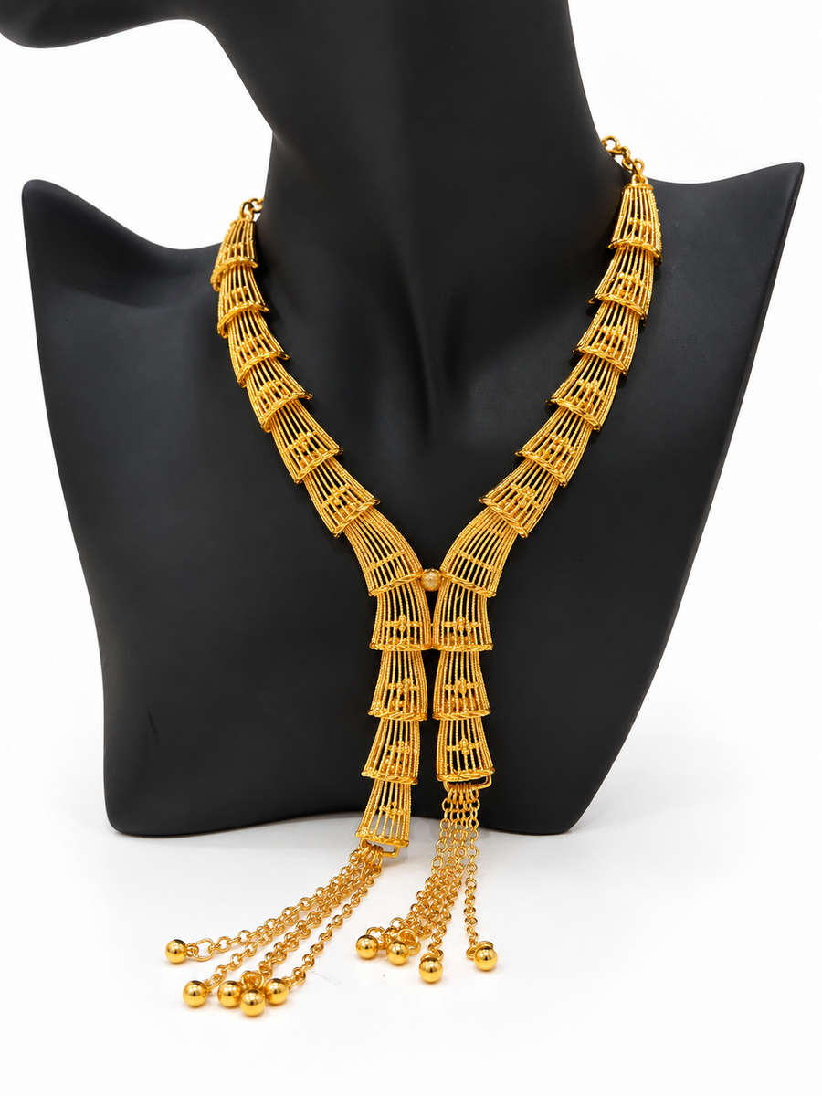 Gold-tone tiered cage necklace with chain tassel drops