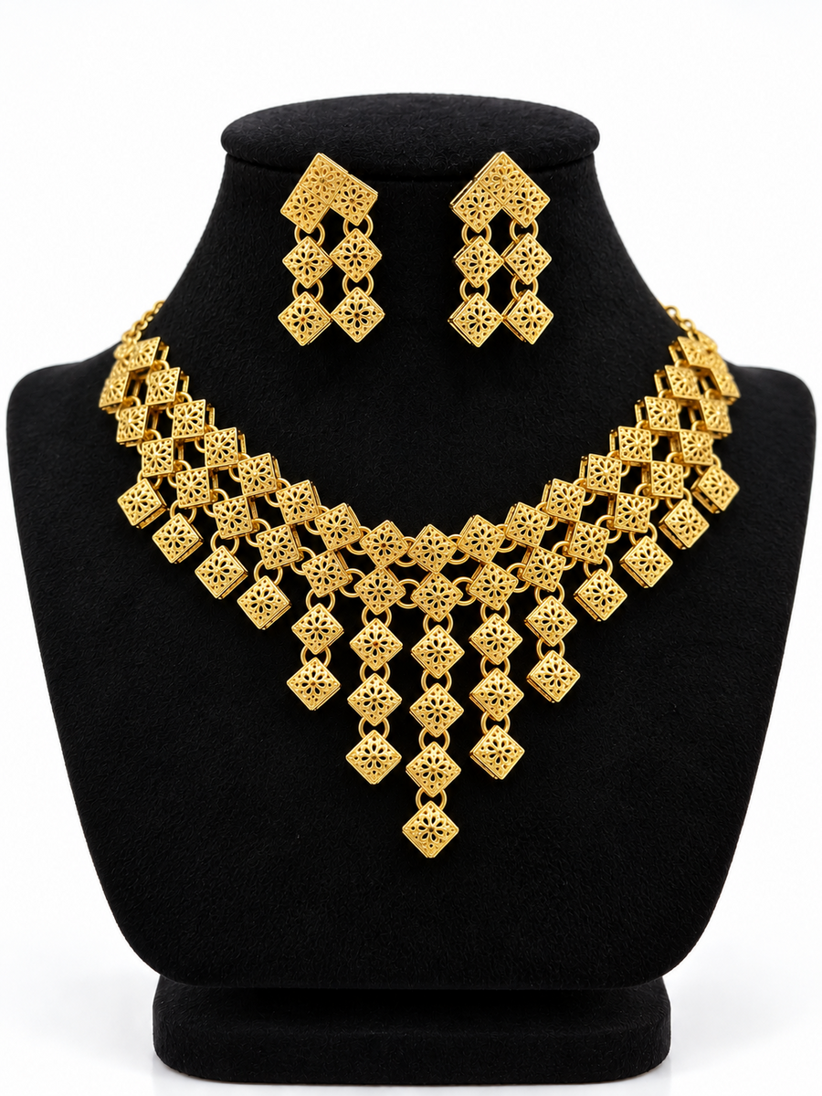 Gold-tone geometric filigree cascade necklace with matching earrings