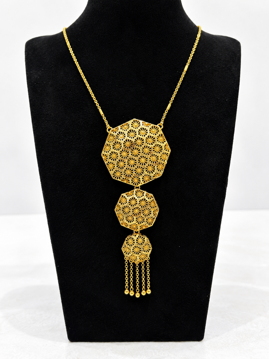 Gold-tone octagon starburst necklace with layered drop pendant