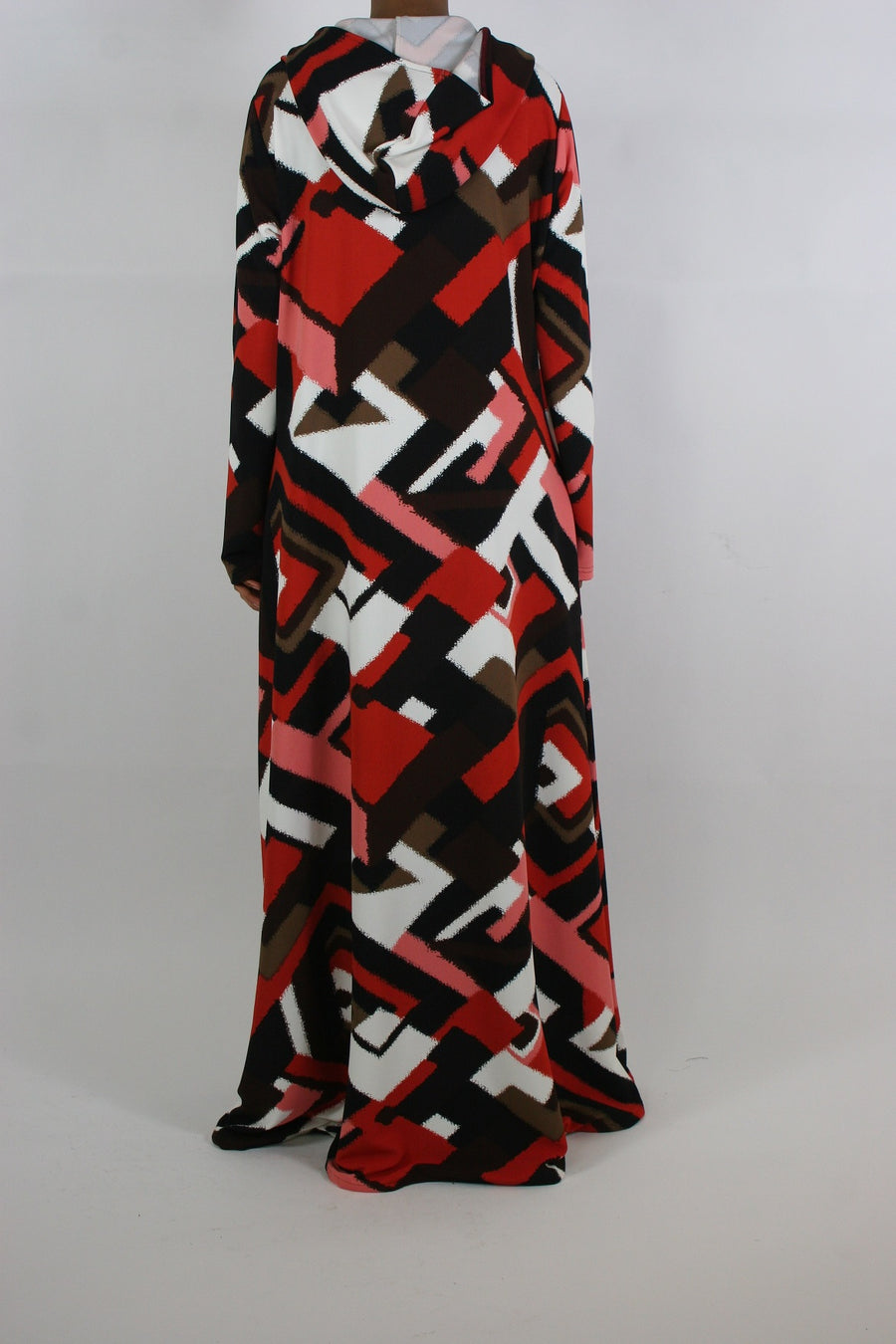 Full-length view of Amani's bold abstract hooded maxi dress