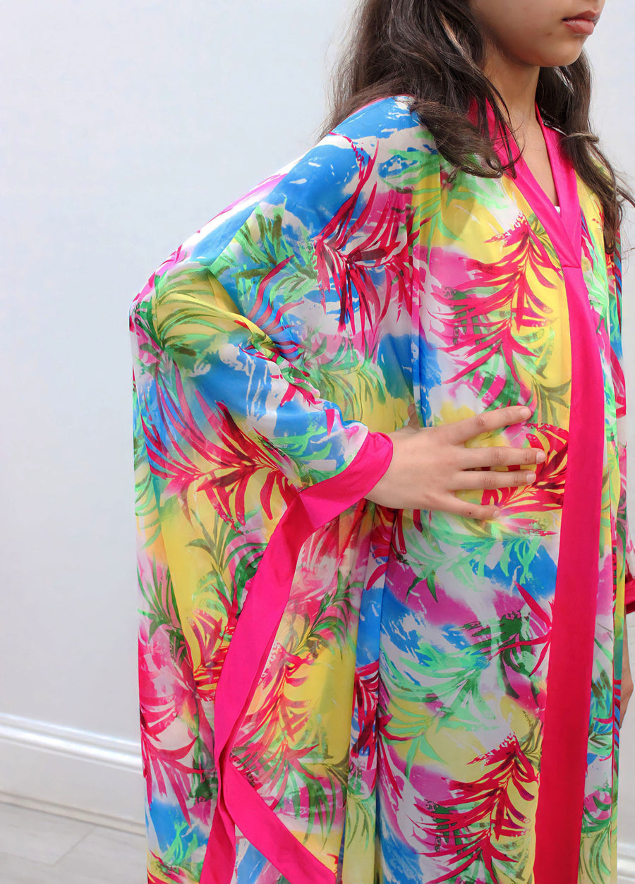 Full-length view of Amani's fuchsia floral chiffon kids kaftan
