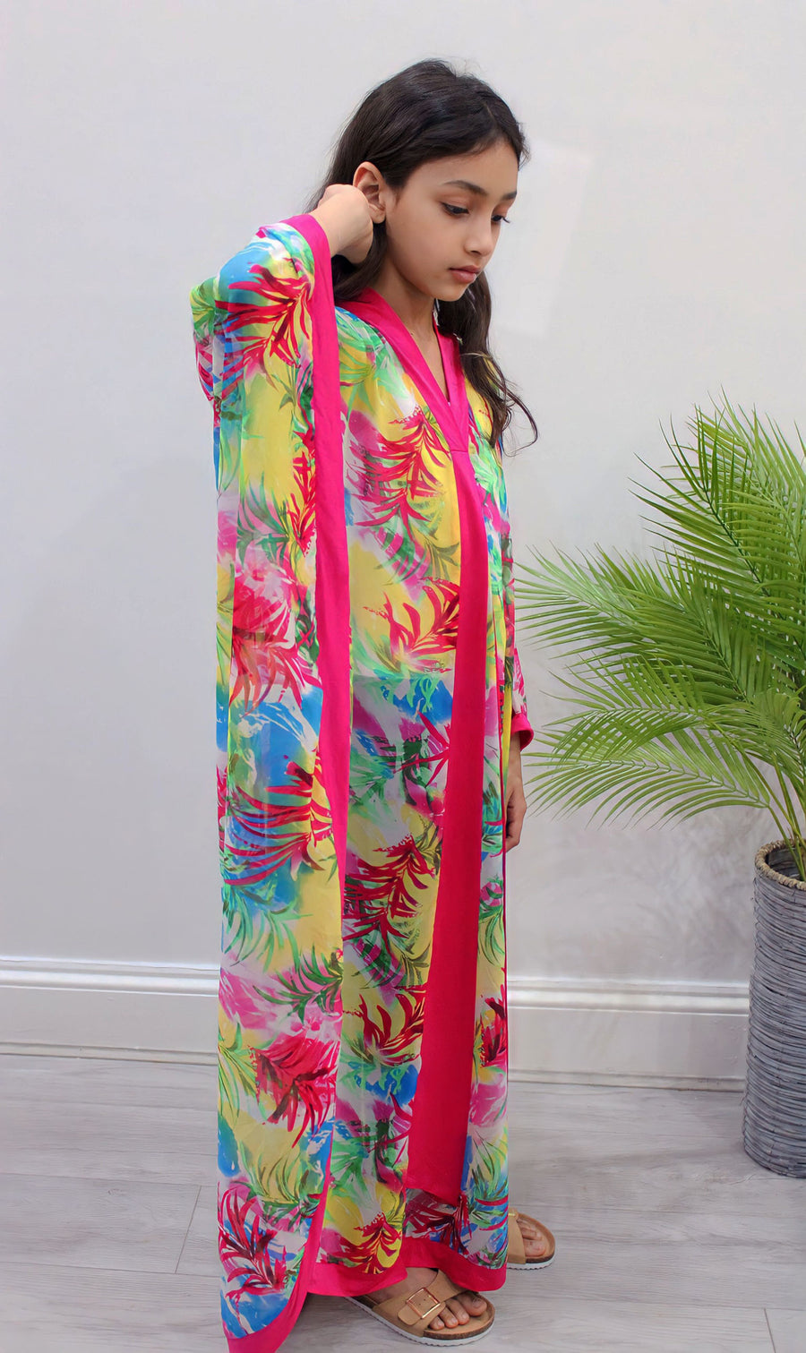 Fuchsia floral chiffon kids kaftan showing the draping side-opening cut