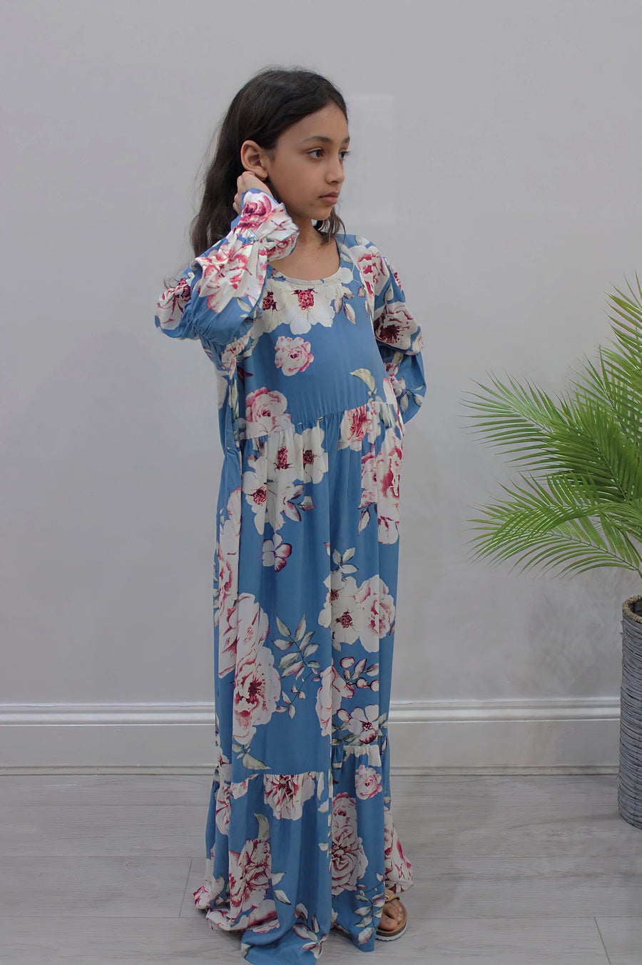 Powder blue floral tiered dress showing the A-line skirt