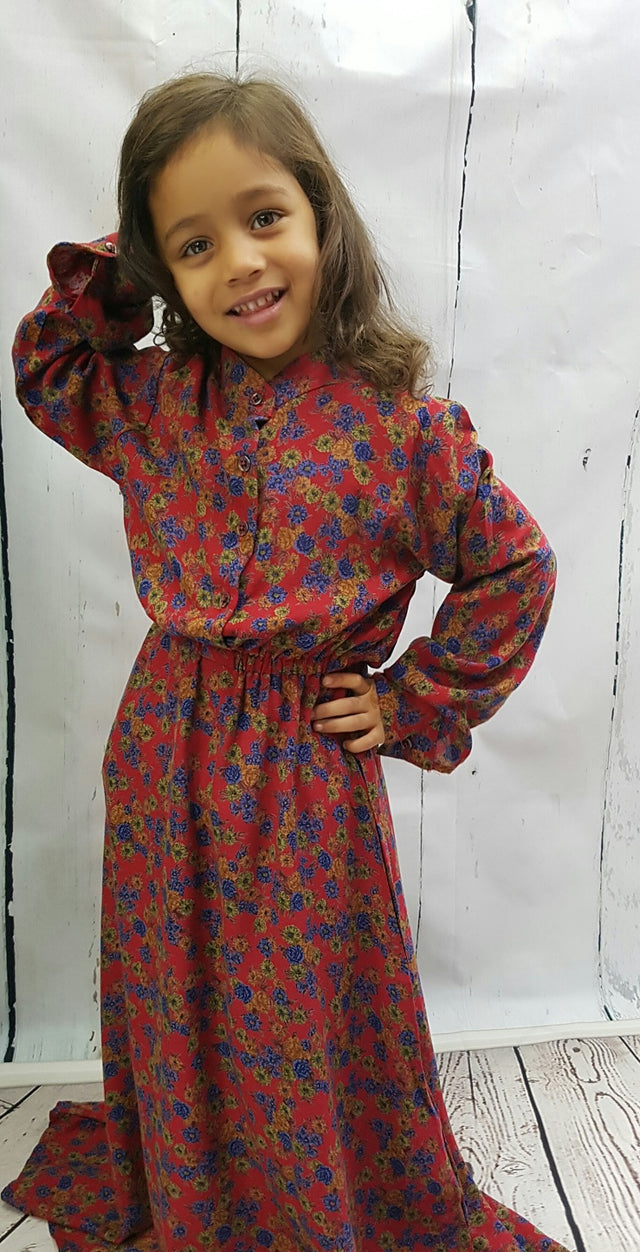 Girl wearing Mia's floral cotton long-sleeve maxi dress